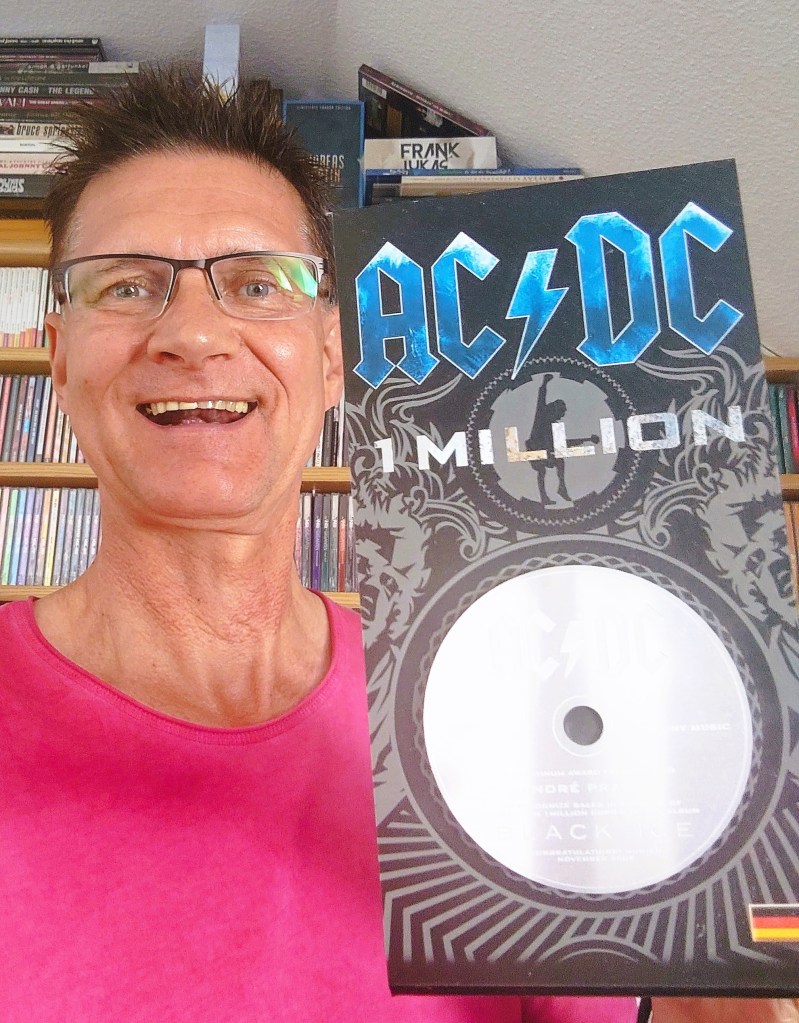Foto André Prager mit Millionen-Award AC/DC